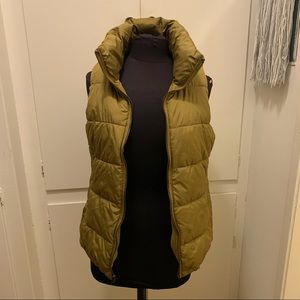 Olive green puffer vest.